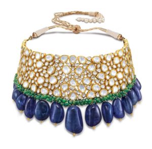 A Jadau neckpiece; crafted using carved emerald beads and south sea pearls dangling from uncut diamonds set in 22K yellow gold
